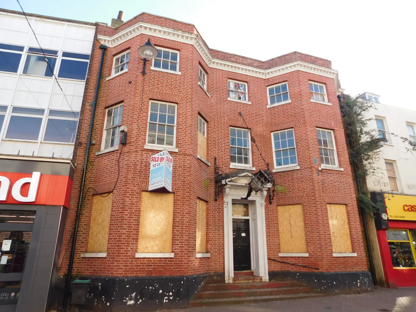 Home House, 45 High Street, Dartford, photographed in March 2019 when its ground floor windows were boarded and the building was on the market
