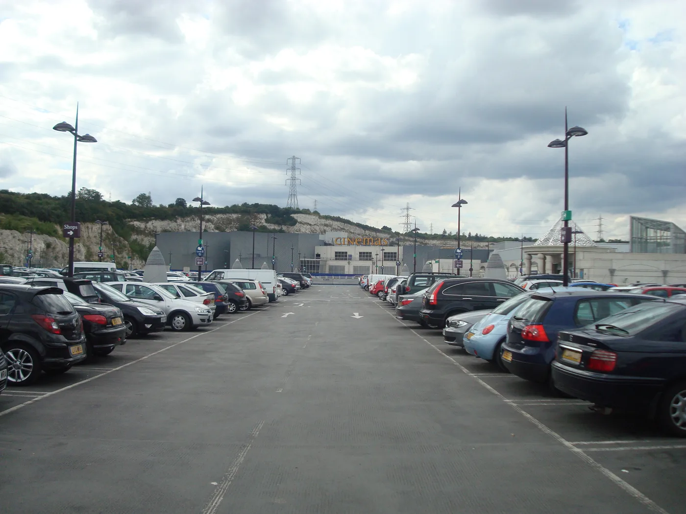 A car park at Bluewater, looking towards the cinema and the chalk quarry face