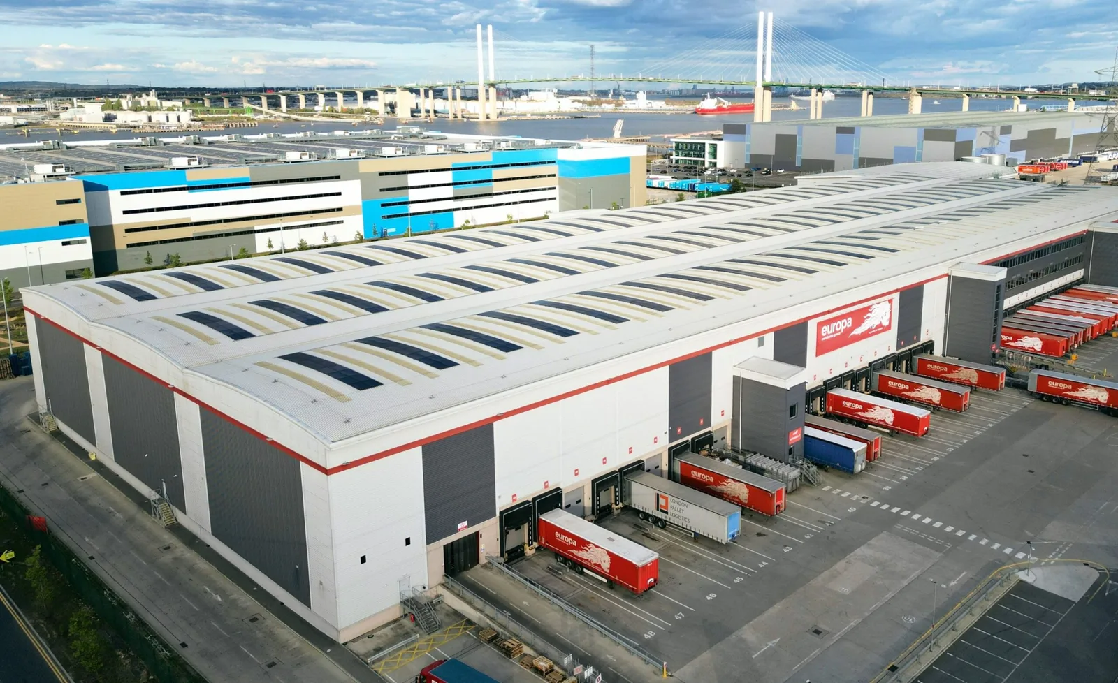 Europa Worldwide Group's Dartford hub beside the Thames, with the QEII Bridge behind.